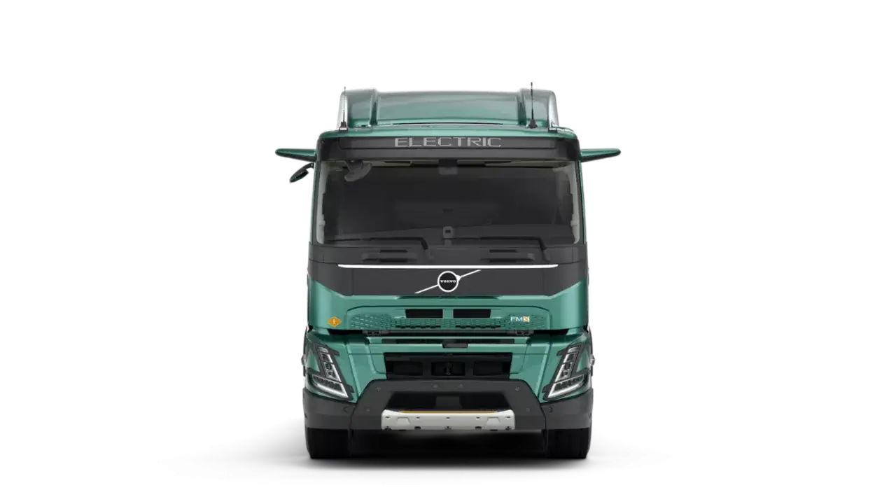 Camión Volvo FMX eléctrico, verde, visto de frente.