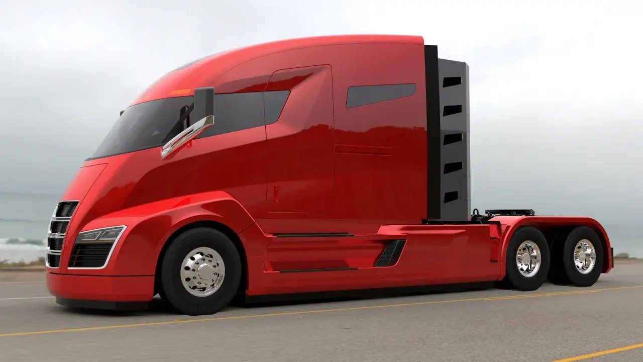 Camiones Nikola, un tractor rojo brillante con diseño futurista, listo para la carretera.