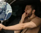 Es peligroso conducir con sueño porque la fatiga reduce la atención y los reflejos, como se ve en este conductor bostezando en medio de un atasco.