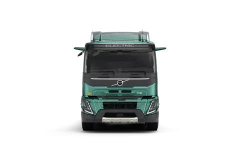 Camión Volvo FMX eléctrico, verde, visto de frente.