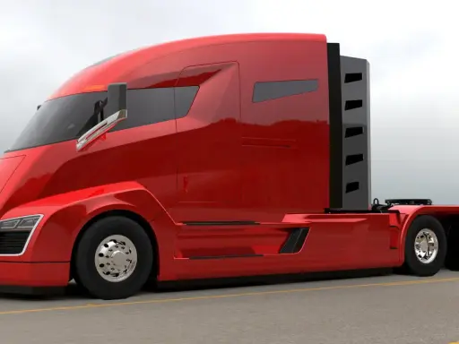 Camiones Nikola, un tractor rojo brillante con diseño futurista, listo para la carretera.
