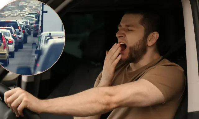 Es peligroso conducir con sueño porque la fatiga reduce la atención y los reflejos, como se ve en este conductor bostezando en medio de un atasco.