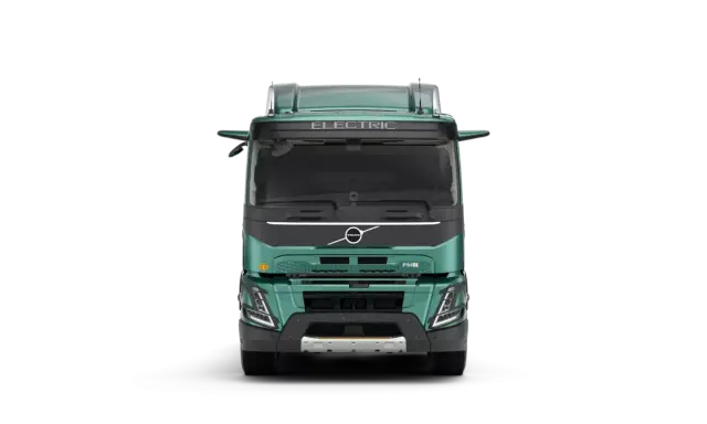 Camión Volvo FMX eléctrico, verde, visto de frente.