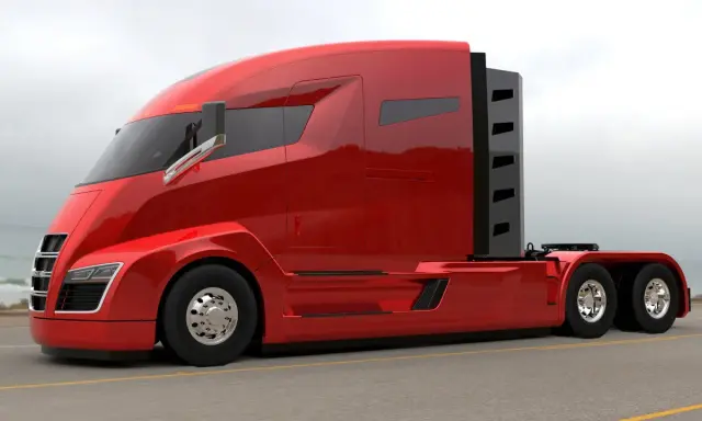 Camiones Nikola, un tractor rojo brillante con diseño futurista, listo para la carretera.